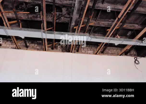 Picture Idea: Exposed Ceiling Reveals Wooden Beams And Metal Ductwork Illustrating