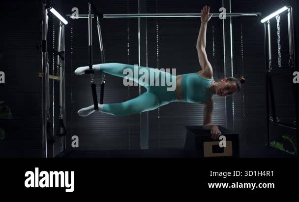 A skilled athlete showcases her strength and balance while executing ...