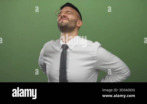 Photo inspiration: Gallery Detail: Young Hispanic Man In Office Attire Grimacing With Back Pain