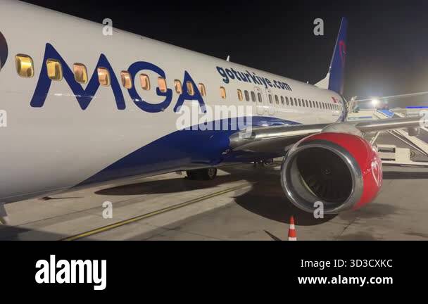 Kemer, Turkey - September 24, 2025: Airplane MGA illuminated at night ...
