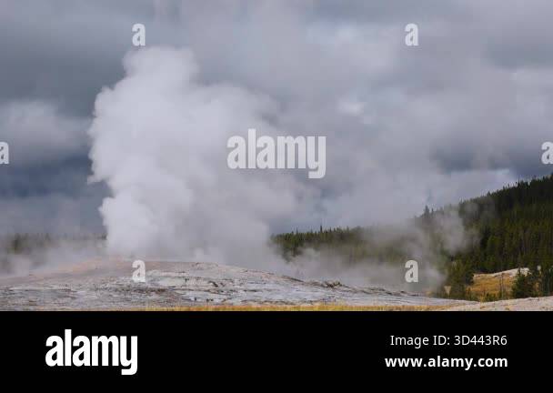 Yellowstone Rising Sun Visitors witness geysers erupting and steam rising in Yellowstone ...