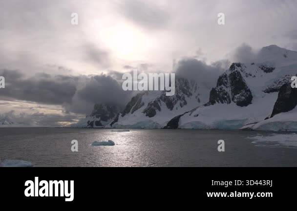 Witness the breathtaking beauty of icebergs floating in the ocean near ...