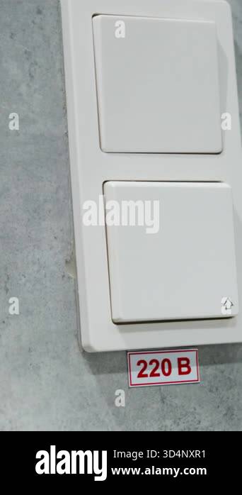 Buttons for turning lights on and off installed neatly on wall. Small ...