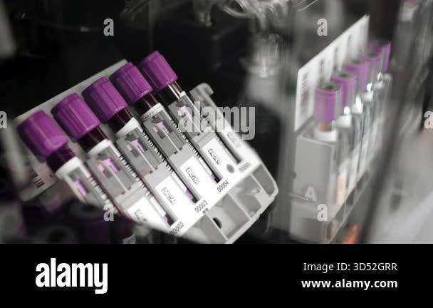 Close up video of blood sample tubes rotating and mixing inside ...
