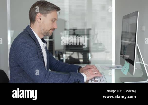 Thoughtful businessman focused on strategic planning, writing notes at ...