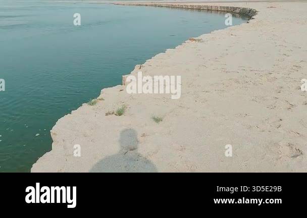 Shadow reflection on shallow puddles across wide exposed riverbed Stock ...