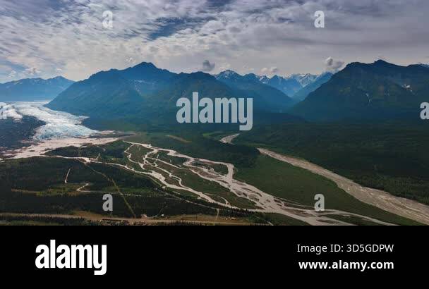 Glacier covers the park of the valley turning into branching river ...