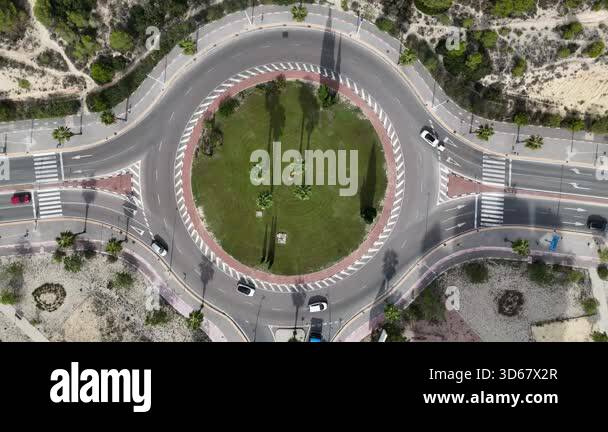 Aerial drone footage of a roundabout traffic circle in Benidorm Spain ...