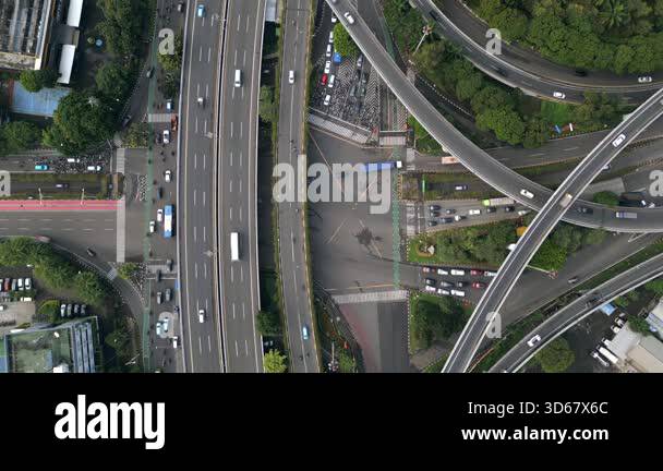 Aerial top-down view of highway interchange with traffic in Jakarta ...