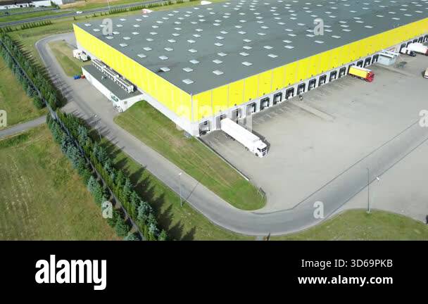 Commercial distribution center with parked cargo trucks Stock Video ...