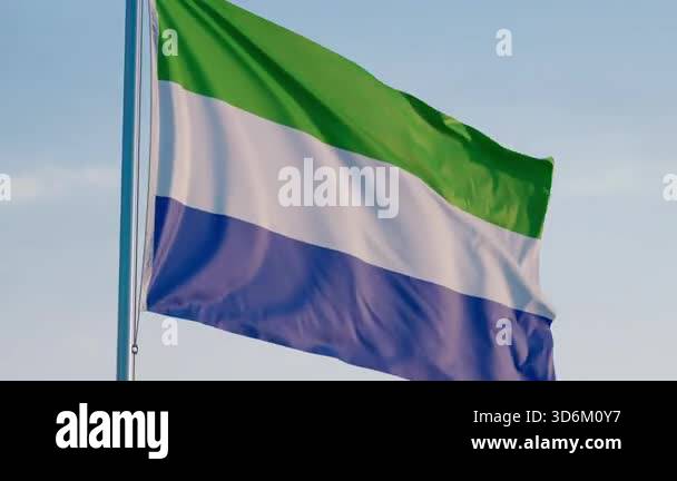 Sierra Leone, Freetown: Cinematic Waving National Flag Against Blue Sky ...