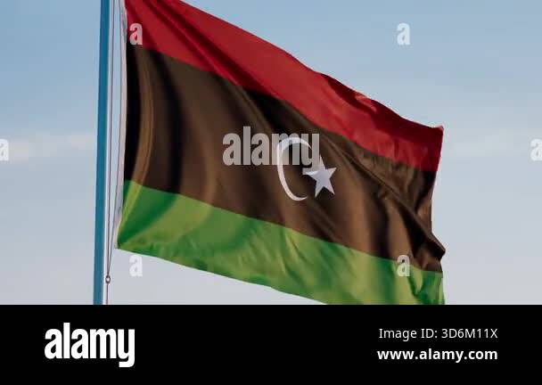 Libya Tripoli Cinematic Waving National Flag Against Blue Sky Stock