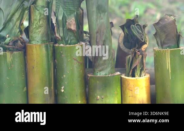 Burning bamboo rice in traditional cooking, asian food. Ubud, island ...