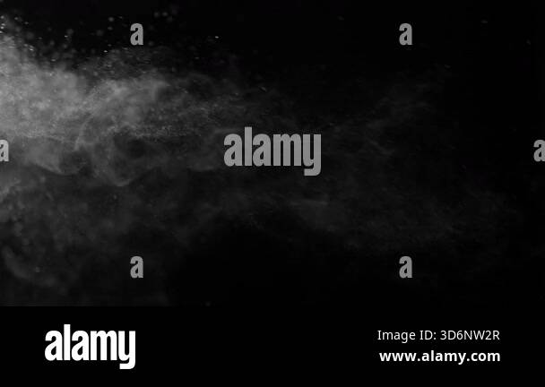 Particles and dust in the air on a black background. Filmed on a high ...