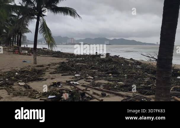 The beach is littered with debris after floods and storms in Nha Trang ...