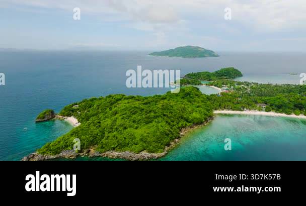 Island with sandy beaches and houses in Alad Island. Romblon ...