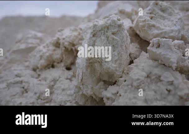 Close-up perspective of synthetic gypsum pile, highlighting texture and ...