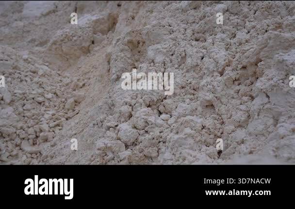 Close-up of synthetic gypsum pile, revealing intricate textures and ...