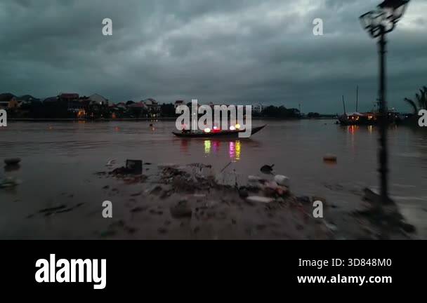 Submerged Overflow flooded city or town with buildings submerged in overflow water and mud ...