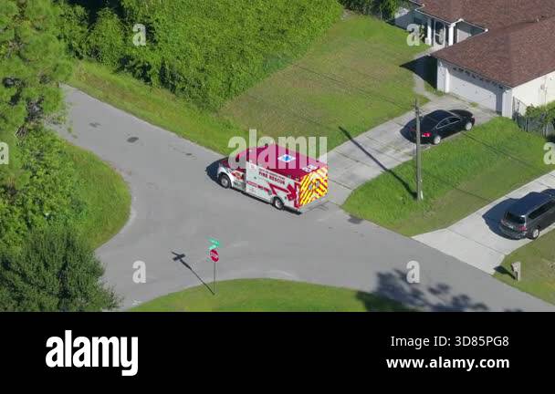 Aerial view of Florida rescue vehicle in motion during emergency call ...