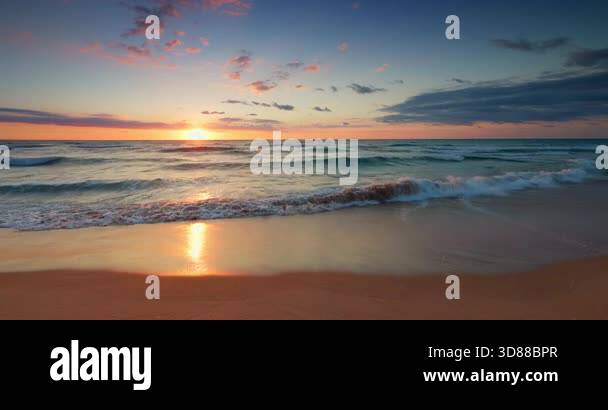 Scenic sunrise over the sea horizon and tropical island beach, the sun ...