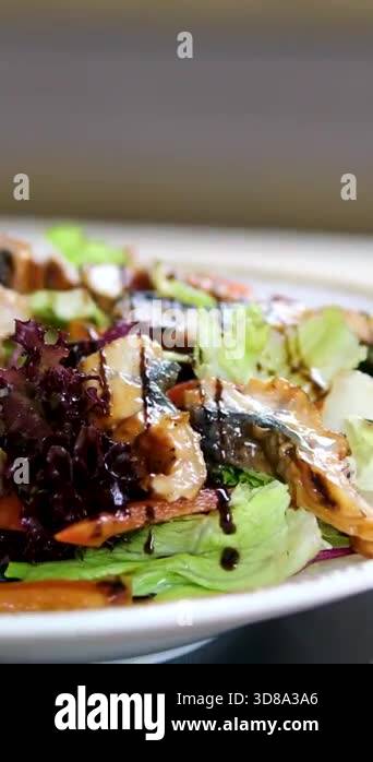 Sprinkle sesame seeds over the eel salad. High quality 4k footage Stock ...