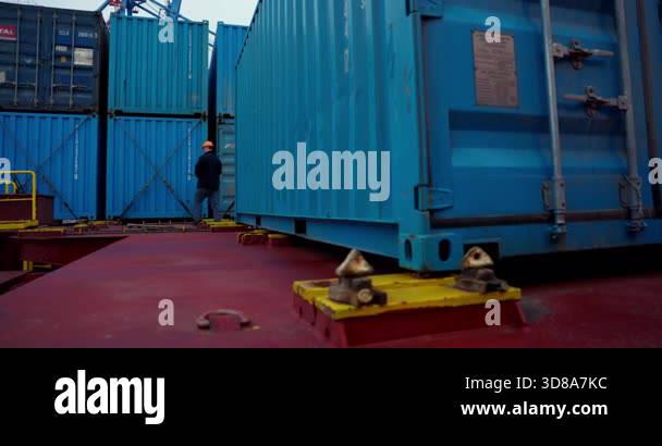 Large open-top container stands among metallic rows glistening after ...