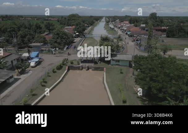 drone view of a dam with irrigation to irrigate rice fields Stock Video ...