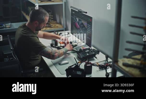 Engineer With Tattooed Testing FPV Drone Electronics, Connecting Wires ...