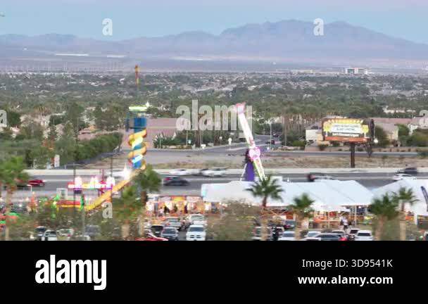 Fair Rides Nevada Aerial flyover of a vibrant fair in Las Vegas Nevada with glowing ...
