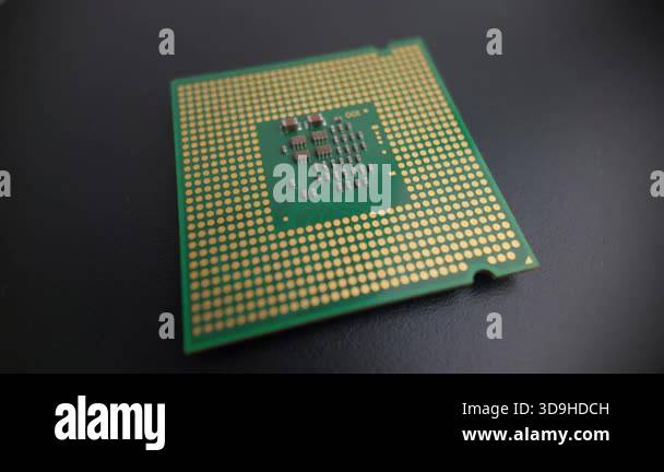 Macro rotating view of a modern CPU underside without pins, showing ...