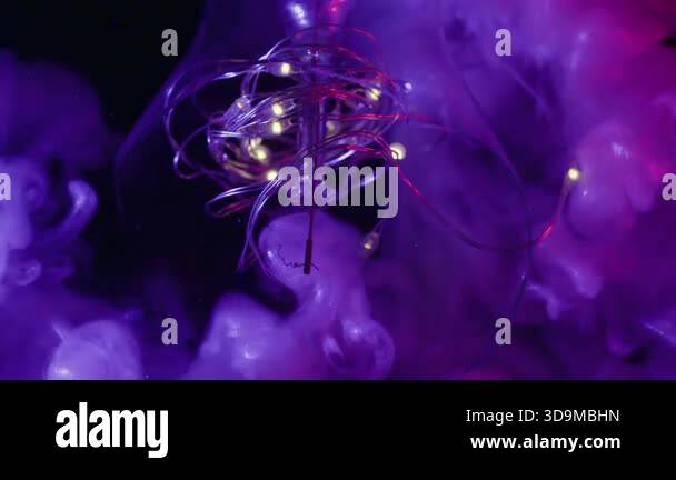 Blur vapor splash. Neon light bulb. Purple violet shiny fluid exploding ...
