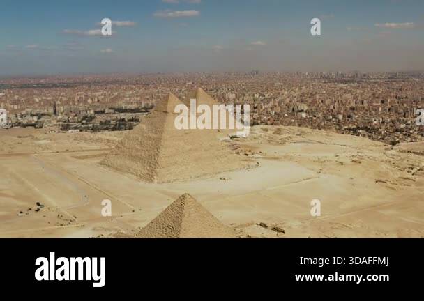 Drone shot captures an aerial view of the Giza pyramids, showcasing the ...
