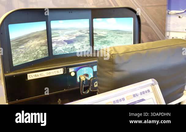 A flight simulator setup with three monitors on a table, displaying ...