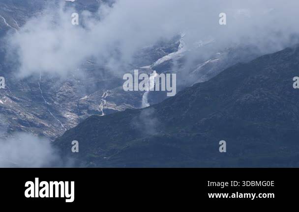 Majestic aerial view of a powerful waterfall cascading down a rocky ...