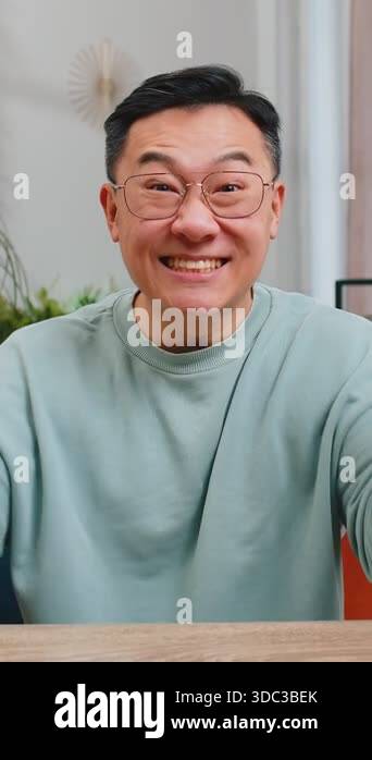Happy Asian man shouting, celebrating success, winning, goal ...