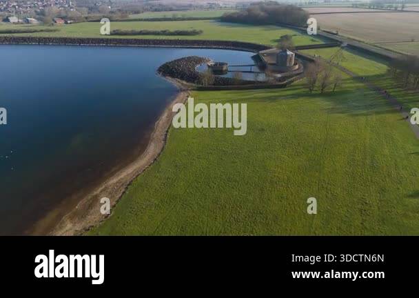 Aerial footage of Rutland Water reservoir, blue waters and sunny skies ...