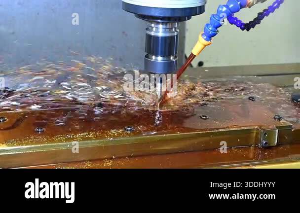 Slow motion scene the CNC milling machine rough cutting the mold parts ...