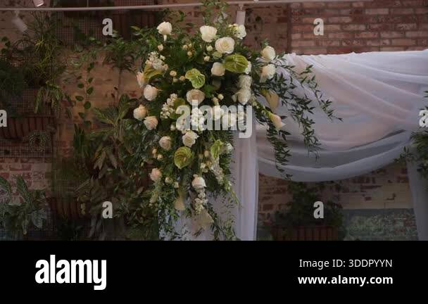 Curated visual reference: Picture Idea: Closeup Floral Pillar With White Roses Trailing Greenery And Soft