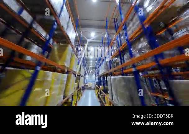 Aerial FPV footage of contemporary warehouse. Large logistic delivery ...