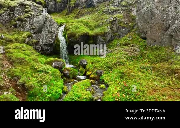 Water rushing over rocks in mountain stream. Rushing water cascades ...