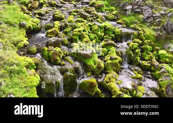 Water rushing over rocks in mountain stream. Rushing water cascades ...