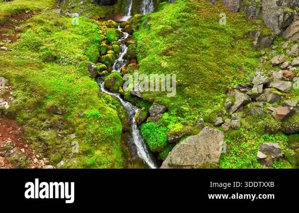 Water rushing over rocks in mountain stream. Rushing water cascades ...