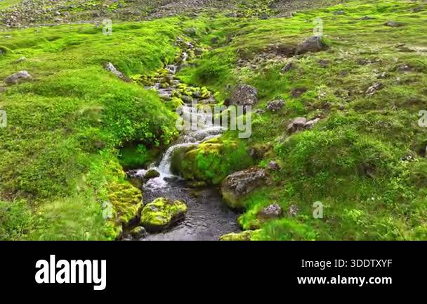 Water rushing over rocks in mountain stream. Rushing water cascades ...