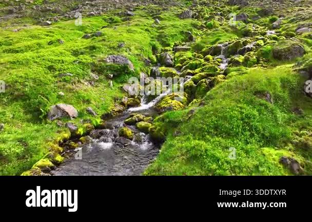 Water rushing over rocks in mountain stream. Rushing water cascades ...