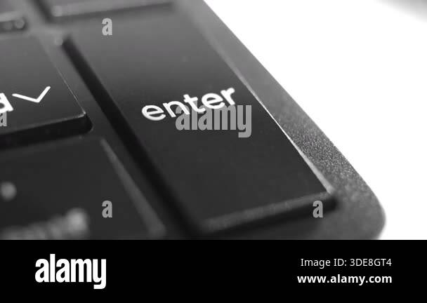 Close up of a computer Enter key, symbolizing digital input, commands ...