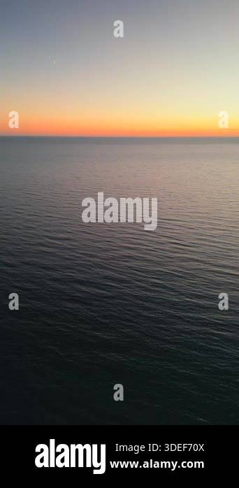 Aerial view of sunset horizon over the sea or ocean. Cinematic drone ...