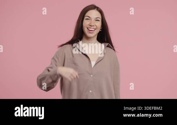 Beautiful young woman asks join her, beckons with inviting hand hugs ...