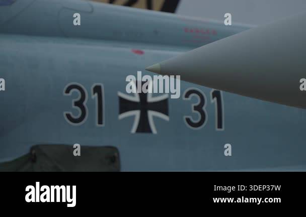 Detail of military jet fuselage with iron cross insignia and aircraft ...