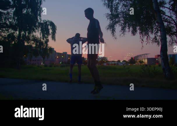 Evening exercise scene, Silhouetted individual performing calming ...
